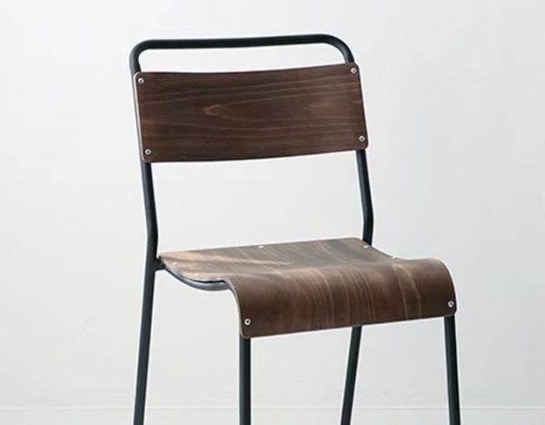 Introducing the Chelsea Chair: a minimalist piece featuring a black metal frame and dark wooden seat and backrest. The seat and backrest are securely attached to the frame with visible screws, creating a modern and simple design suitable for various settings. The background is plain white, highlighting its elegant simplicity.
