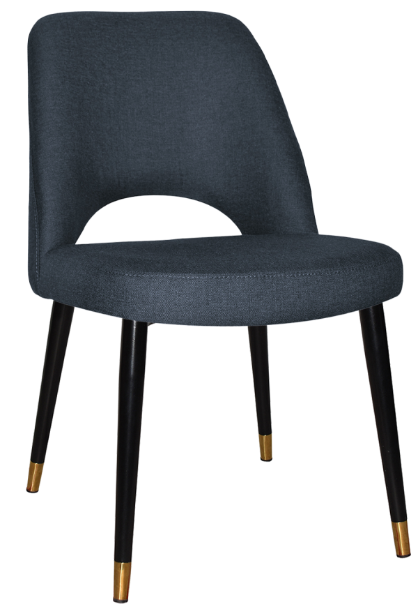 The Albury Black Brass Metal Leg Chair features a modern design with a dark gray upholstered seat and backrest. It showcases black tapered legs with brass-finished tips and a slightly curved backrest that includes an open lower section near the seat.