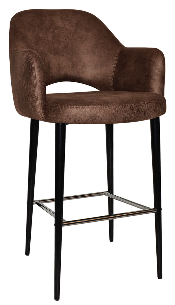 A modern bar stool with a brown suede upholstered seat and backrest. It features a cutout design at the rear of the seat and has four slim, black metal legs connected by a footrest.