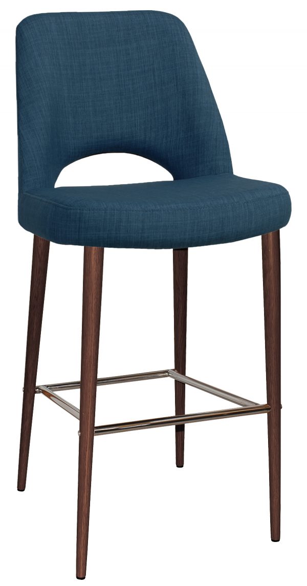 A bar stool with a blue upholstered seat and backrest. It has an open lower back cutout and four wooden legs joined by metal footrests. The design is modern and sleek with a simple, clean style.