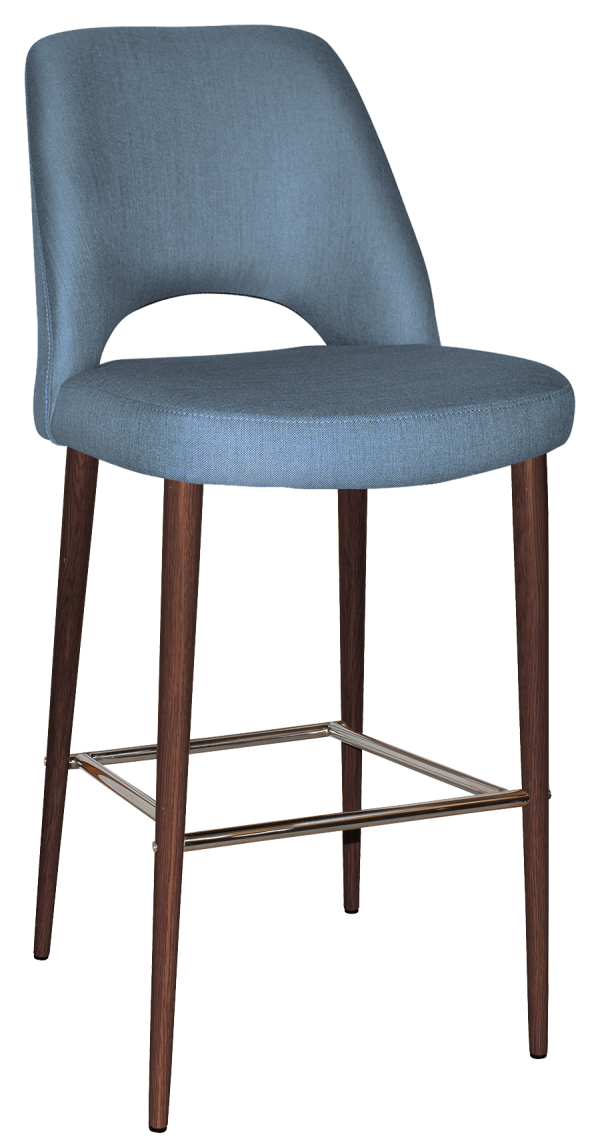 A modern bar stool with a blue upholstered seat and backrest. The stool has a curved design with a cutout between the seat and backrest. The legs are dark wooden, featuring a metal footrest connecting them.