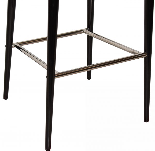 Close-up view of the lower part of a black stool with four legs and a square metal footrest connecting the legs near the bottom. The metal footrest appears to have a shiny, reflective surface. The background is plain white.