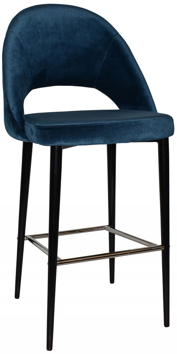 A modern barstool with a curved backrest, upholstered in dark blue velvet fabric. The stool has four slender black legs, supported by metal rods as footrests. The design features an open lower back and a cushioned seat for comfort.