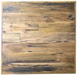 The Australian Made Recycled Table Top Natural Finish is a square wooden surface that boasts a rustic appearance with a blend of various brown shades. The wood grain pattern is prominently visible, displaying variations in color and texture that contribute to its natural and aged look. The edges of the table top are subtly darker, enhancing its overall character.