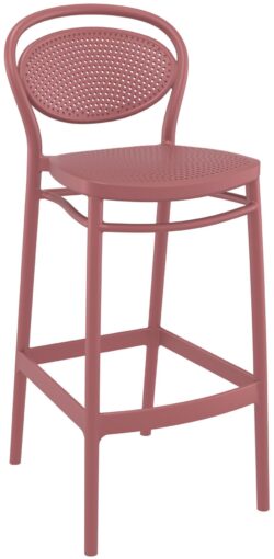 The Marcel Barstool is a tall, stylish pink bar stool featuring a round, perforated backrest and matching perforated seat. It boasts four legs connected by a footrest, all crafted from the same material, lending it a modern and cohesive design.