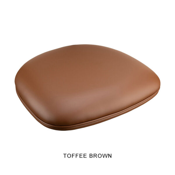 A toffee brown, square Bon Bon Chair with rounded edges is shown against a white background. The chair has a smooth, leather-like texture. The words "TOFFEE BROWN" are written below the chair in black, uppercase letters.